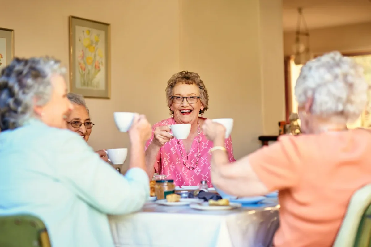 Assisted Care vs Memory Care Family Decision Guide Springfield OR Senior Hispanic woman sitting with her adult daughter during a supportive conversation about assisted care vs memory care options