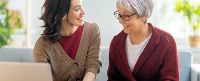 how to talk to a parent about assisted care shown through an adult daughter having a supportive conversation with her older mother.